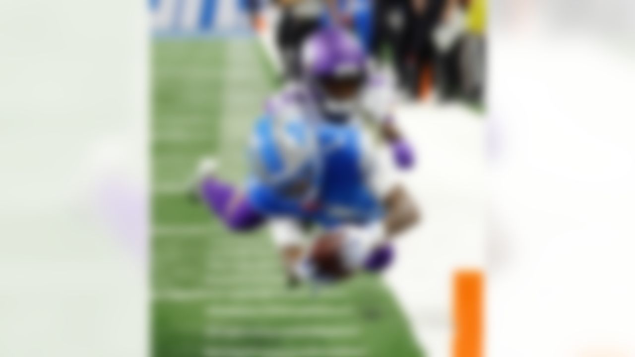 Detroit Lions wide receiver Jameson Williams (1) dives for a touchdown as Minnesota Vikings cornerback Isaiah Rodgers (2) tries to tackle him during an NFL football game in Detroit on Nov. 2, 2025.