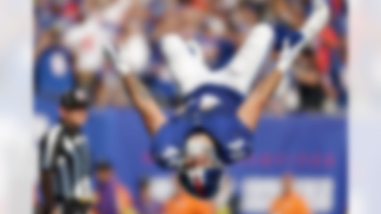 New York Giants running back Cam Skattebo (44) does a back flip after scoring on a two-point conversion against the Los Angeles Chargers during the third quarter of an NFL football game, Sunday, Sept. 28, 2025, in East Rutherford, N.J.