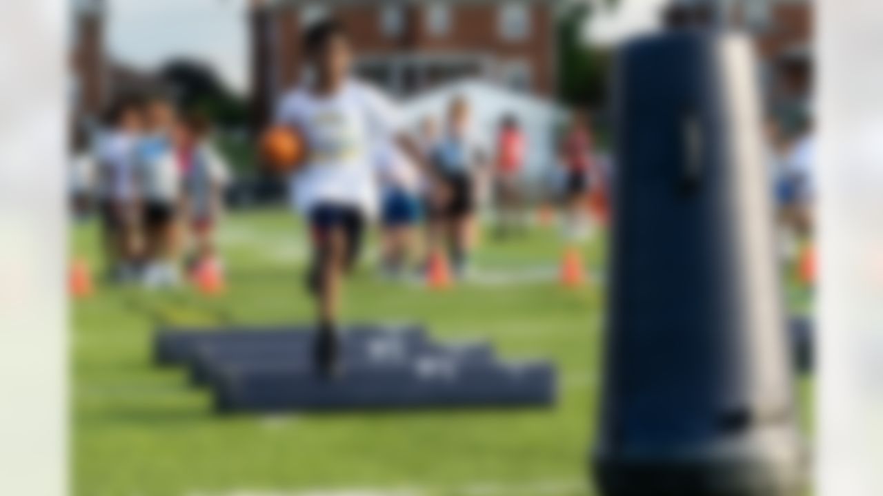 Kids run drills during the Play Football Skills Camp on Tuesday, July 29, 2025 in Canton.