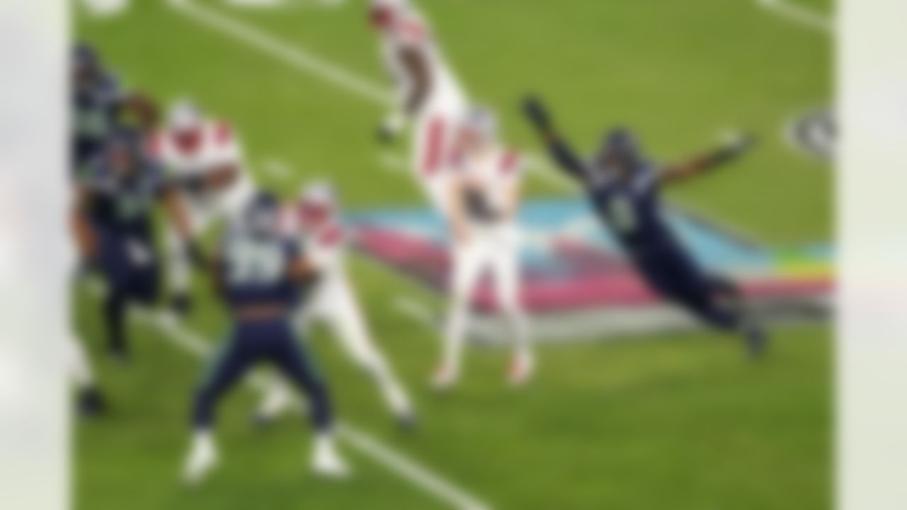 Seattle Seahawks defensive end DeMarcus Lawrence (0) pressures New England Patriots quarterback Drake Maye (10) during the NFL Super Bowl LX football game on Sunday, February 8, 2026 in Santa Clara, Calif.