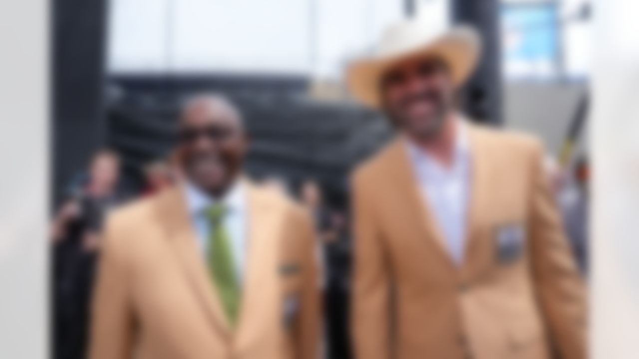 Hall of Fame inductees Sterling Sharpe and Jared Allen smile during the Pro Football Hall of Fame Class of 2025 Enshrinement Ceremony on Saturday, August 2, 2025 in Canton, Ohio.
