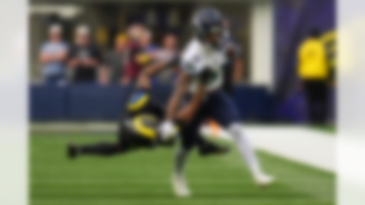 Seattle Seahawks wide receiver Jaxon Smith-Njigba fends off Los Angeles Rams cornerback Cobie Durant during the first half of an NFL football game on Sunday, Nov. 16, 2025, in Inglewood, Calif.