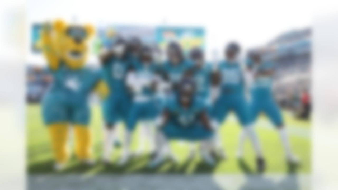 Jacksonville Jaguars cornerback Montaric Brown (30), defensive end Josh Hines-Allen (41) and cornerback Jourdan Lewis (2) pose for a photo during an NFL football game against the New York Jets on Sunday, December 14, 2025 in Jacksonville, Florida.