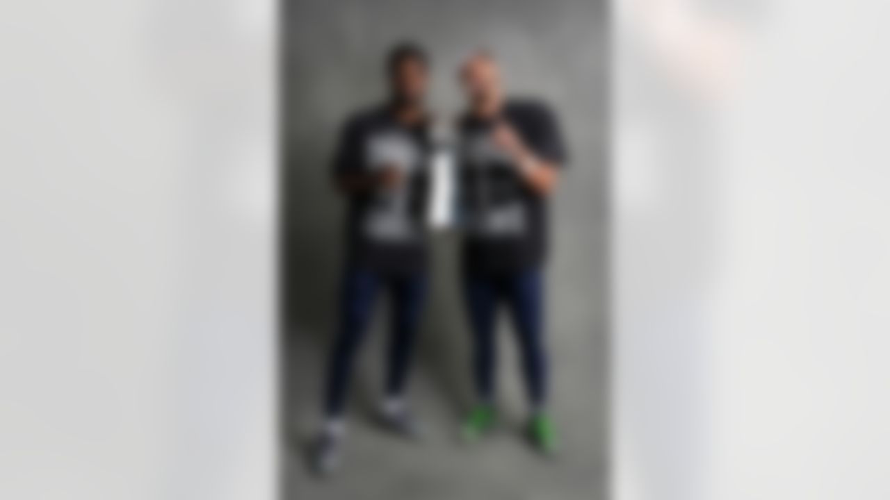 Seattle Seahawks cornerback Devon Witherspoon (21) and wide receiver Jaxon Smith-Njigba (11) pose for a portrait with the Vince Lombardi Trophy after the NFL Super Bowl LX football game against the New England Patriots on Sunday, February 8, 2026 in Santa Clara, Calif.