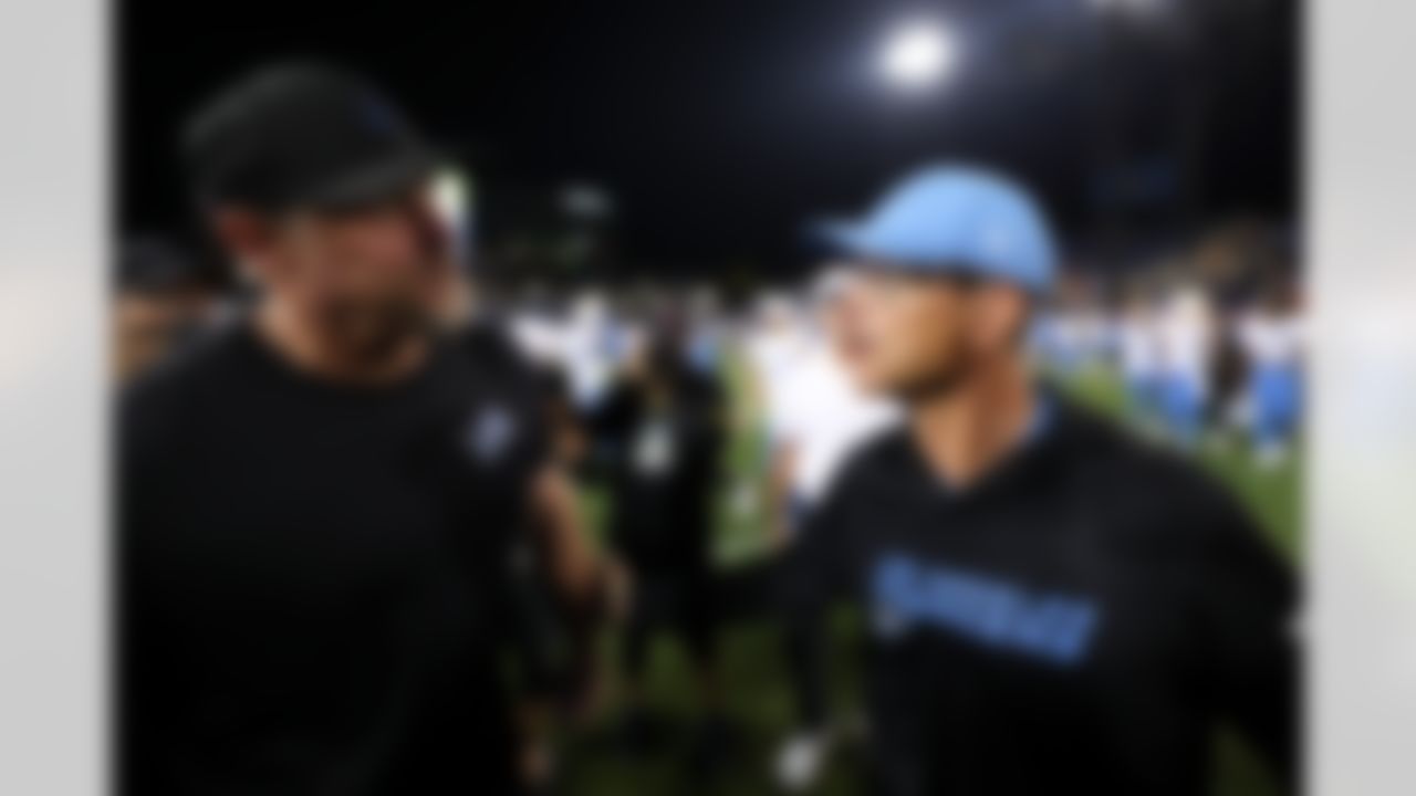 Detroit Lions head coach Dan Campbell and Los Angeles Chargers head coach Jim Harbaugh talk after an NFL football game on Thursday, July 31, 2025 in Canton, Ohio.