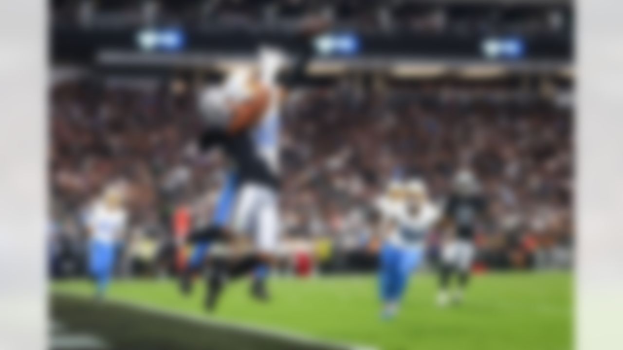Los Angeles Chargers safety Alohi Gilman (32) breaks up a pass during an NFL football game against the Las Vegas Raiders on Monday, Sept. 15, 2025 in Las Vegas.