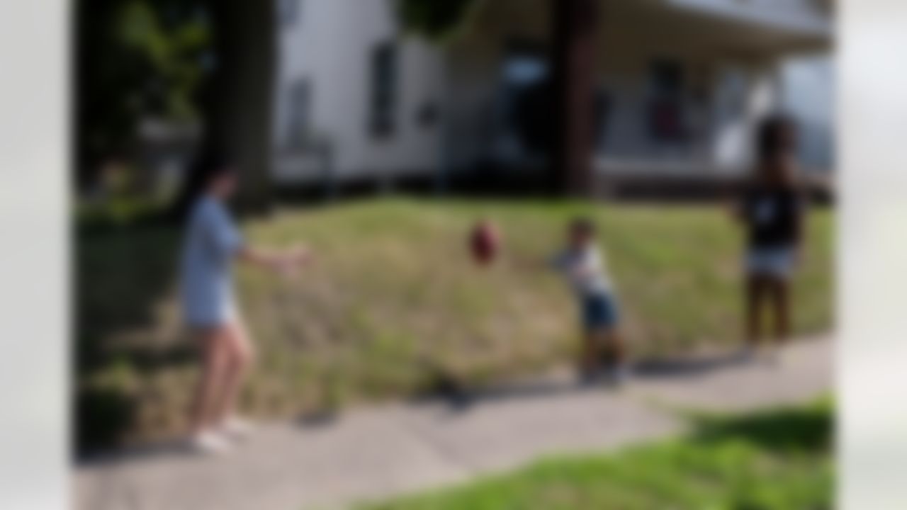 Kids pass the football during the Play Football First Play on Wednesday, July 30, 2025 in Canton.