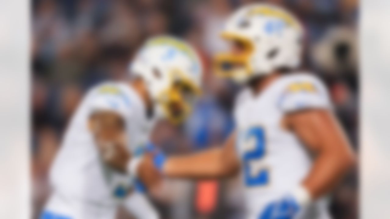 Los Angeles Chargers quarterback Trey Lance (5) and tight end Tucker Fisk (42) high five during an NFL football game against the Detroit Lions on Thursday, July 31, 2025 in Canton, Ohio.