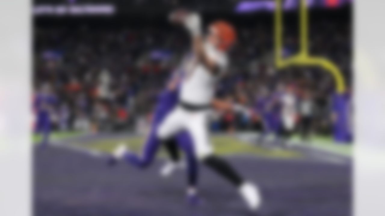 Cincinnati Bengals tight end Tanner Hudson (87) catches a touchdown pass against Baltimore Ravens safety Kyle Hamilton (14) during the second half of an NFL football game, Thursday, Nov. 27, 2025, in Baltimore.