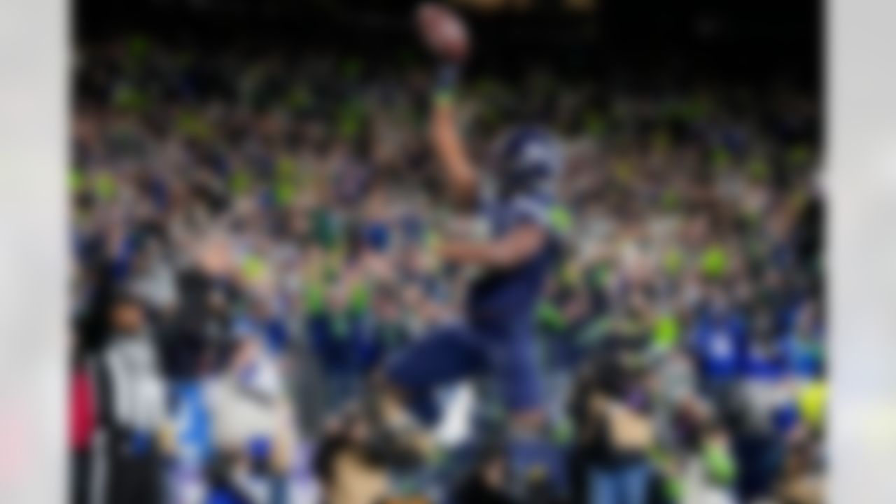 Seattle Seahawks running back Kenneth Walker III (9) celebrates after scoring a touchdown during the second half of an NFL football divisional playoff game against the San Francisco 49ers, Saturday, Jan. 17, 2026, in Seattle.