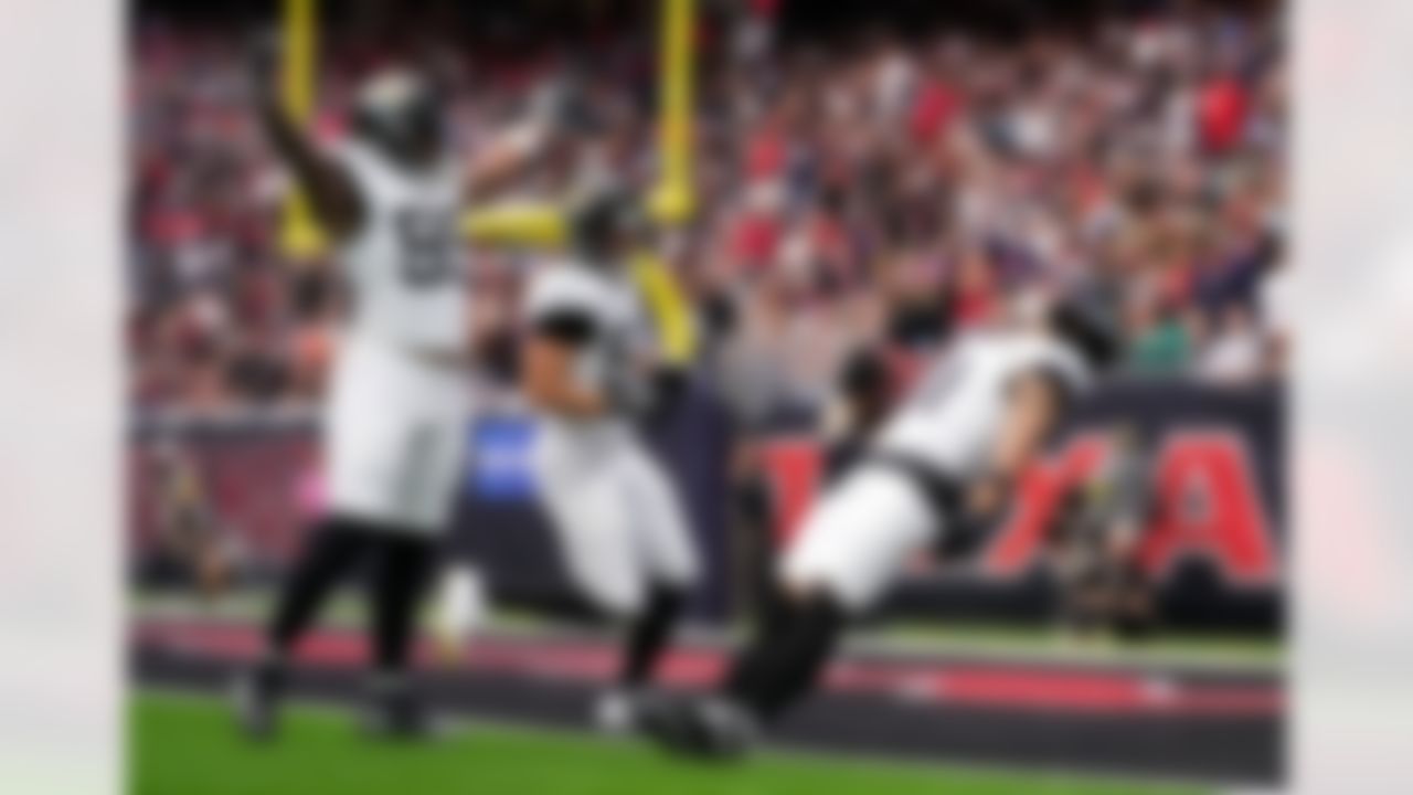 Jacksonville Jaguars wide receiver Parker Washington (11) scores a touchdown after a punt return during an NFL football game, Sunday, Nov. 9, 2025, in Houston.