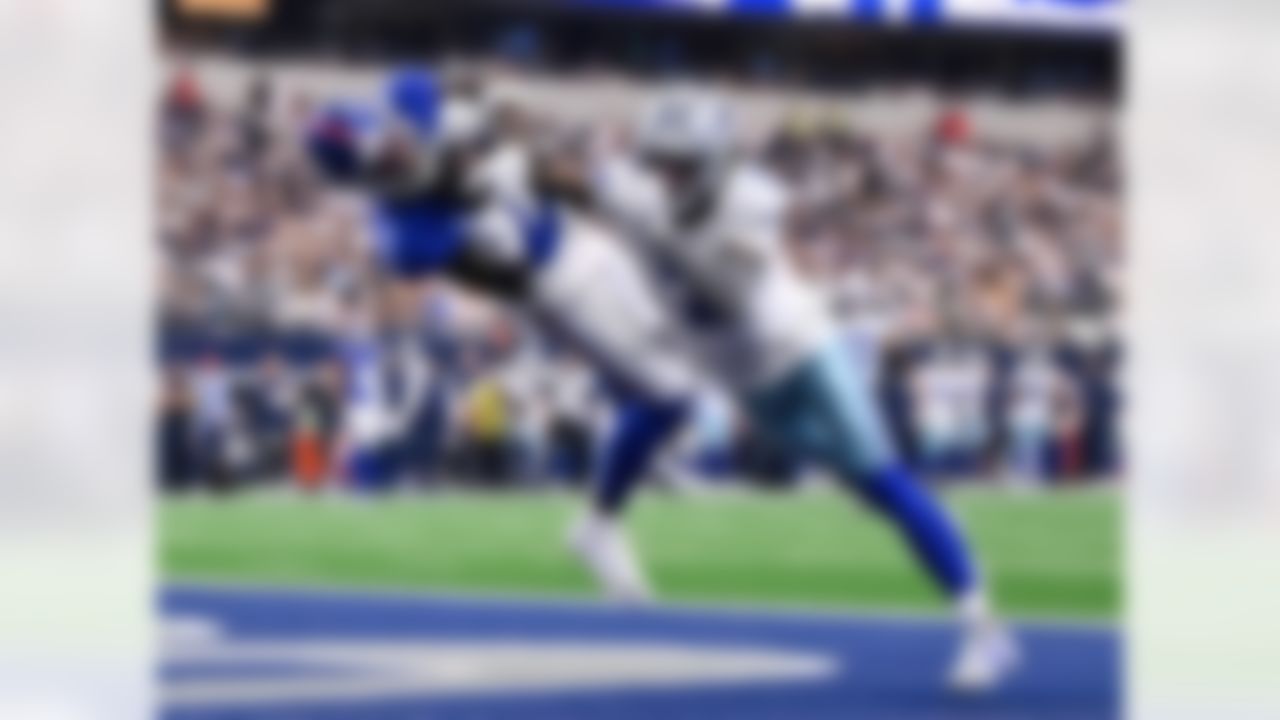 New York Giants wide receiver Malik Nabers catches a touchdown pass as Dallas Cowboys cornerback Trevon Diggs (7) defends in the first half of an NFL football game Sunday, Sept. 14, 2025, in Arlington, Texas.