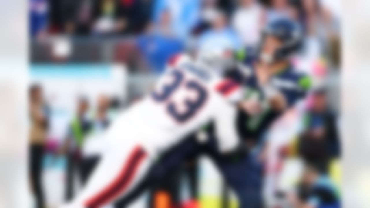 New England Patriots linebacker Anfernee Jennings (33) tackles Seattle Seahawks quarterback Sam Darnold (14) during the NFL Super Bowl LX football game on Sunday, February 8, 2026 in Santa Clara, Calif.