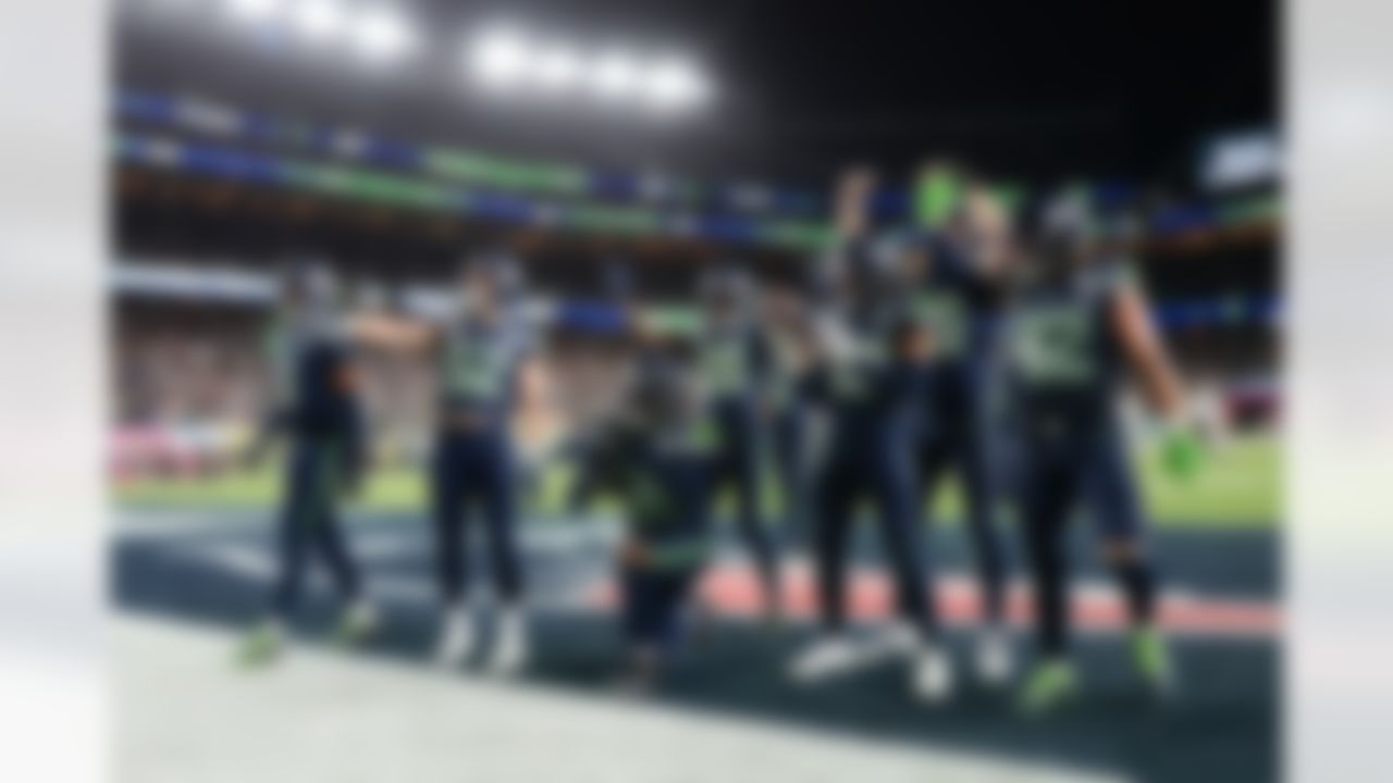 Seattle Seahawks safety Julian Love (20) celebrates his interception with teammates during the NFL Super Bowl LX football game against the New England Patriots on Sunday, February 8, 2026 in Santa Clara, Calif.