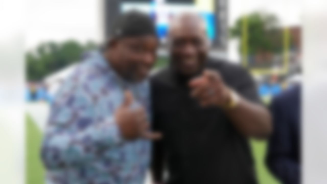 Hall of Fame defensive tackles Warren Sapp and John Randle pose prior to an NFL football game between the Los Angeles Chargers and Detroit Lions on Thursday, July 31, 2025 in Canton, Ohio.