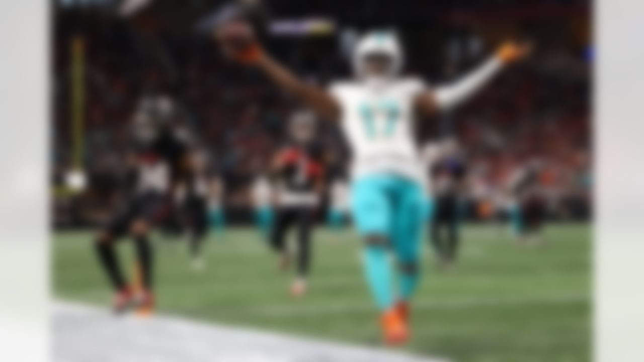 Miami Dolphins wide receiver Jaylen Waddle (17) scores a touchdown during the second half of an NFL football game against the Atlanta Falcons, Sunday, Oct. 26, 2025, in Atlanta.