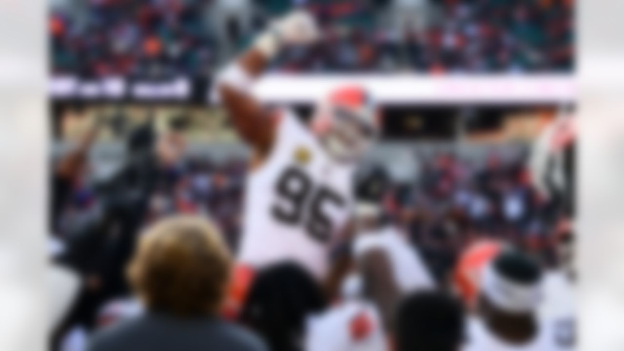Cleveland Browns defensive end Myles Garrett, center, celebrates with teammates after breaking the NFL single season sack record during the second half of an NFL football game against the Cincinnati Bengals in Cincinnati, Sunday, Jan. 4, 2026.