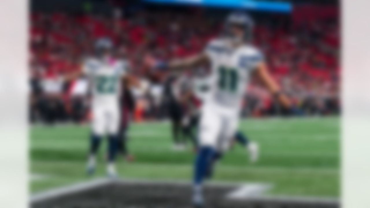 Seattle Seahawks wide receiver Jaxon Smith-Njigba (11) celebrates a touchdown during the second half of an NFL football game against the Atlanta Falcons, Sunday, Dec. 7, 2025, in Atlanta.