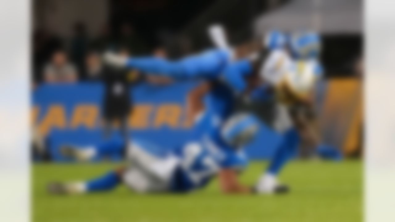 Los Angeles Chargers wide receiver Dalevon Campbell (38) is tackled during an NFL football game against the Detroit Lions on Thursday, July 31, 2025 in Canton, Ohio.