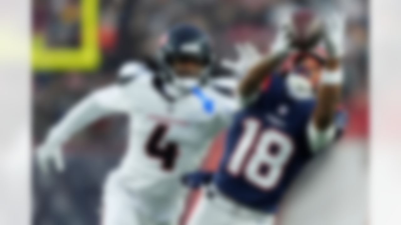 New England Patriots wide receiver Kyle Williams (18) cannot catch a pass against Houston Texans cornerback Kamari Lassiter (4) during the first half of an NFL divisional playoff football game, Sunday, Jan. 18, 2026, in Foxborough, Mass.
