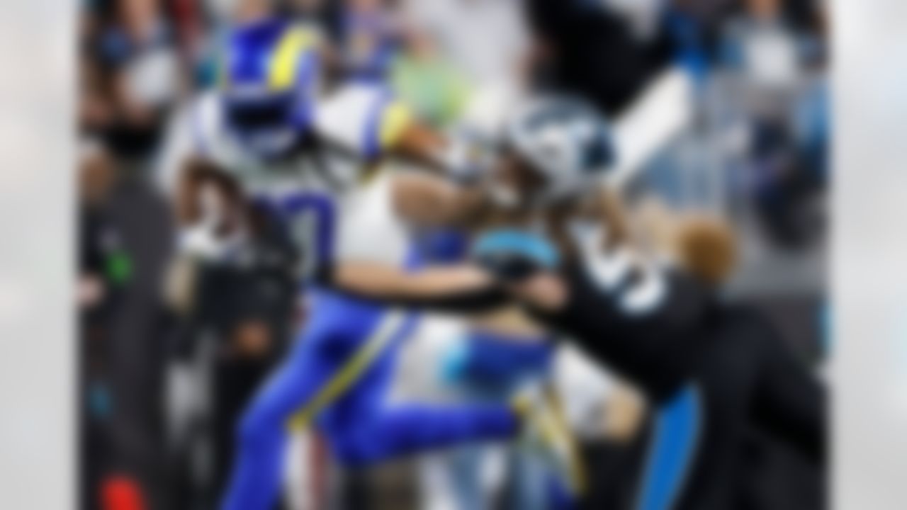 Los Angeles Rams wide receiver Davante Adams (17) is tackled by Carolina Panthers linebacker Christian Rozeboom during the second half of an NFL wild-card playoff football game, Saturday, Jan. 10, 2026, in Charlotte, N.C.