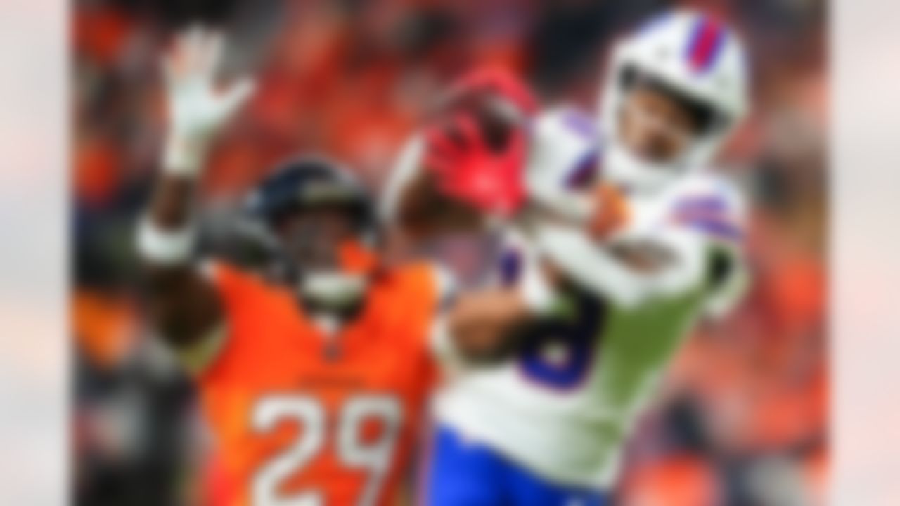 Buffalo Bills wide receiver Brandin Cooks (18) attempts to make a catch under pressure from Denver Broncos cornerback Ja'Quan McMillian (29) during an NFL football game on Saturday, January 17, 2026 in Denver, Colorado.
