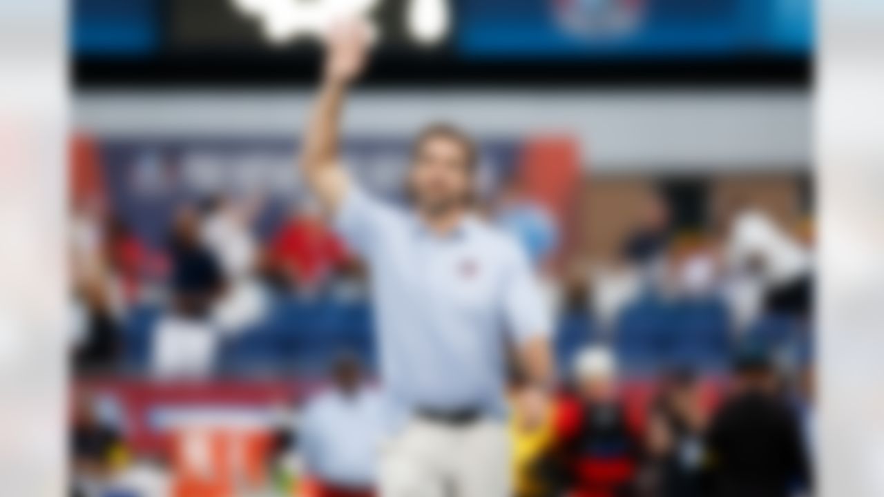 Hall of Fame inductee Jared Allen waves prior to an NFL football game between the Los Angeles Chargers and Detroit Lions on Thursday, July 31, 2025 in Canton, Ohio.