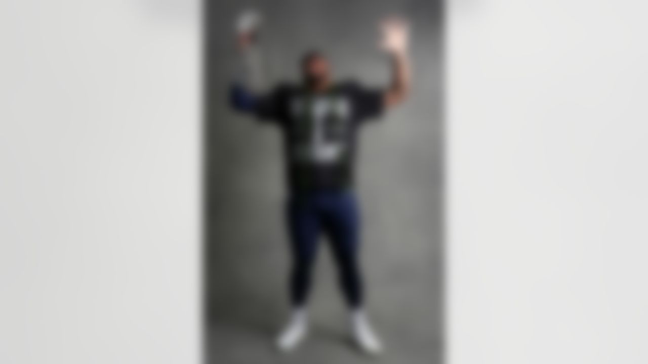 Seattle Seahawks defensive end Leonard Williams (99) poses for a portrait with the Vince Lombardi Trophy after the NFL Super Bowl LX football game against the New England Patriots on Sunday, February 8, 2026 in Santa Clara, Calif.