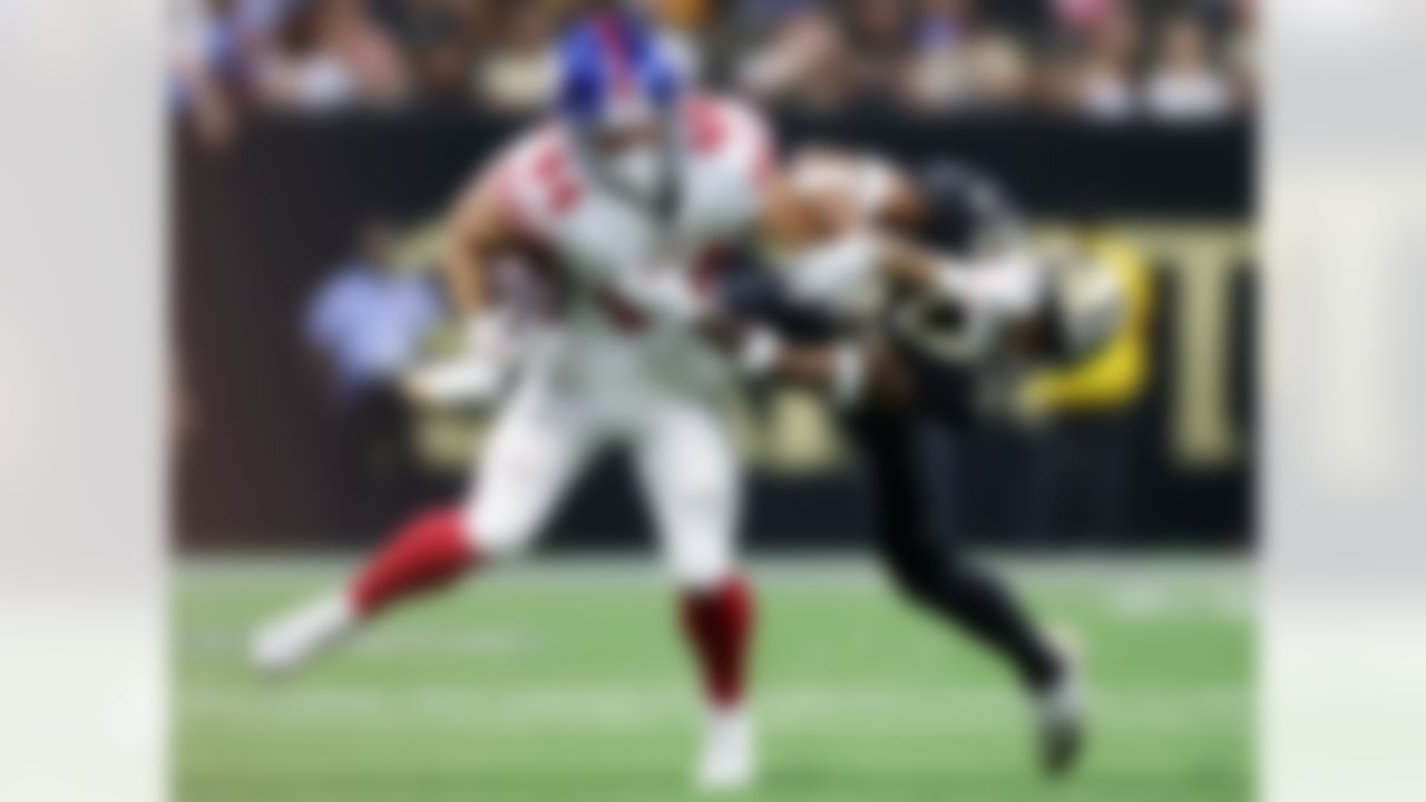 New York Giants running back Cam Skattebo (44) attempts to elude a tackle by New Orleans Saints safety Jonas Sanker (33) during an NFL football game on Sunday, October 5, 2025 in New Orleans, Louisiana.