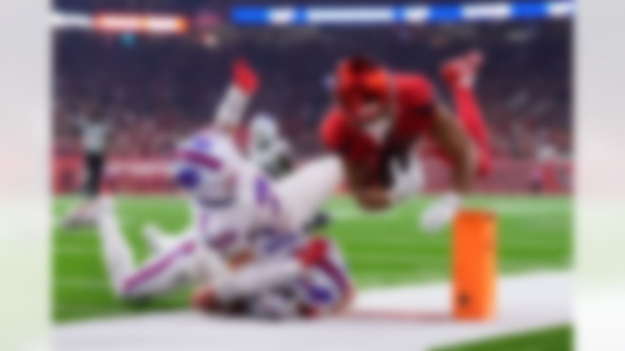 Houston Texans wide receiver Xavier Hutchinson, right, is tackled by Buffalo Bills' Taron Johnson (7) and Cole Bishop (24) in the first half of an NFL football game Thursday, Nov. 20, 2025, in Houston.