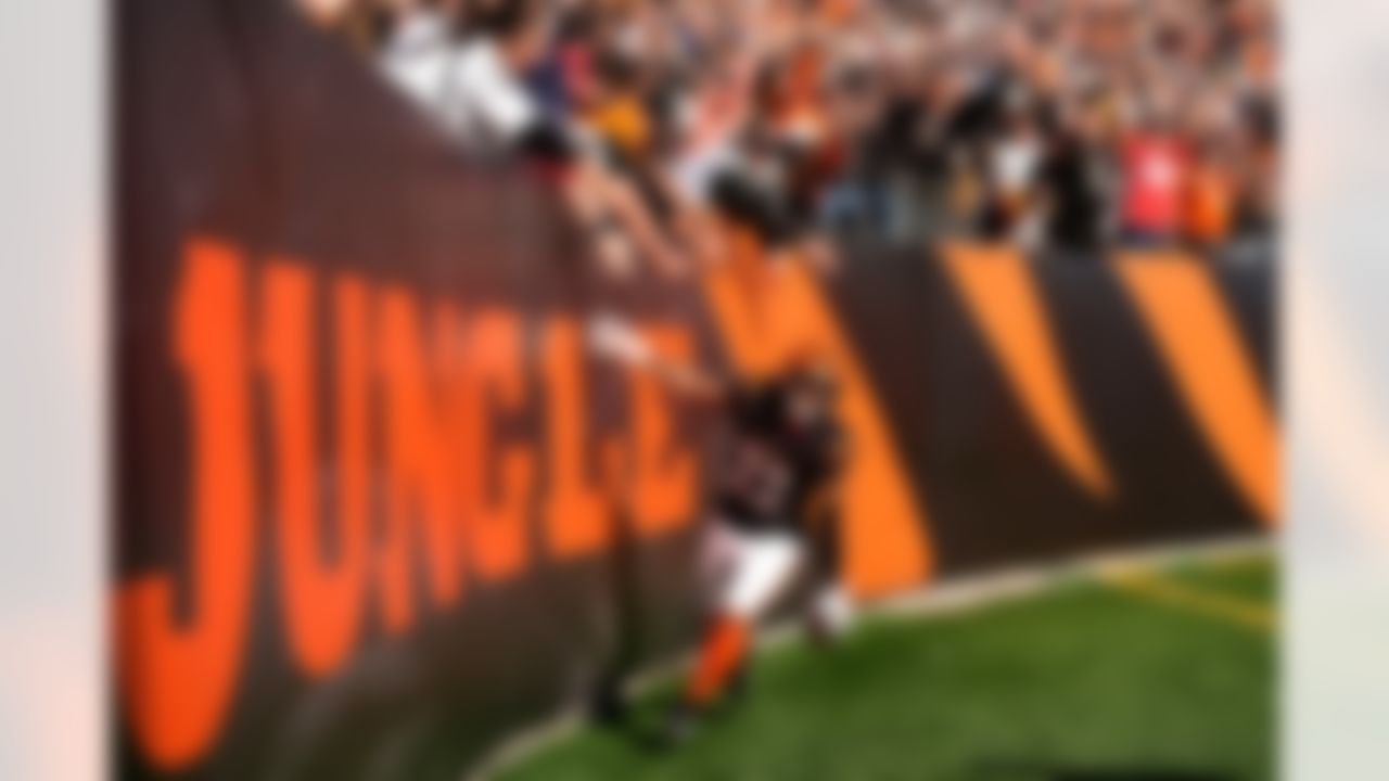 Cincinnati Bengals safety Geno Stone celebrates after returning an interception for a touchdown during the first half of an NFL football game against the New England Patriots, Sunday, Nov. 23, 2025, in Cincinnati.=