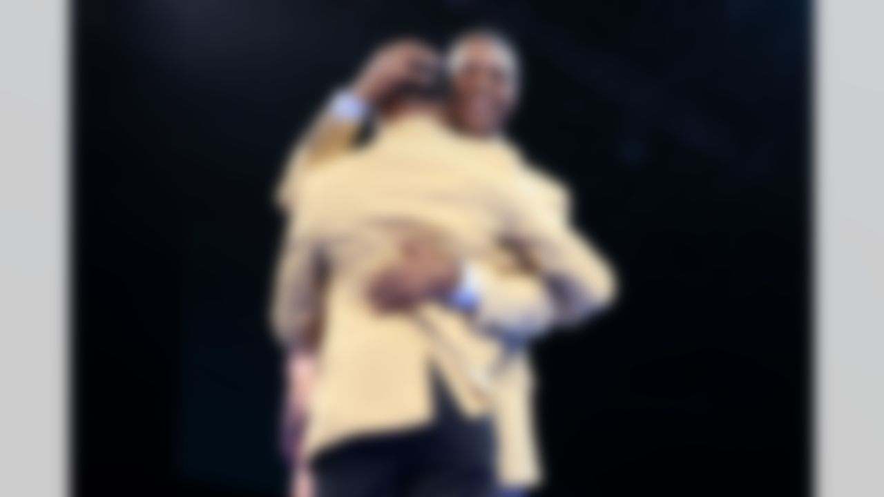 Hall of Fame inductee Eric Allen and Hall of Fame running back Marcus Allen embrace during the Pro Football Hall of Fame Gold Jacket Dinner on Friday, August 1, 2025 in Canton, Ohio.