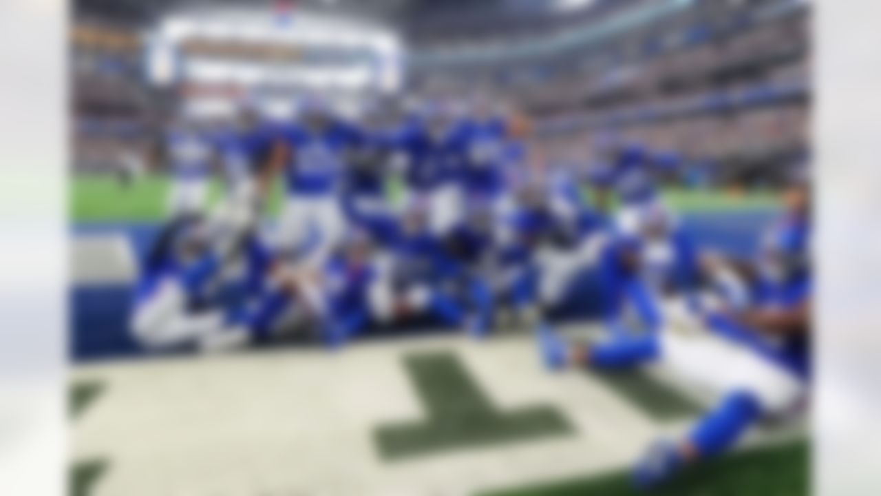 The New York Giants celebrate after Dru Phillips (22) intercepted a pass in the second half of an NFL football game against the Dallas Cowboys Sunday, Sept. 14, 2025, in Arlington, Texas.