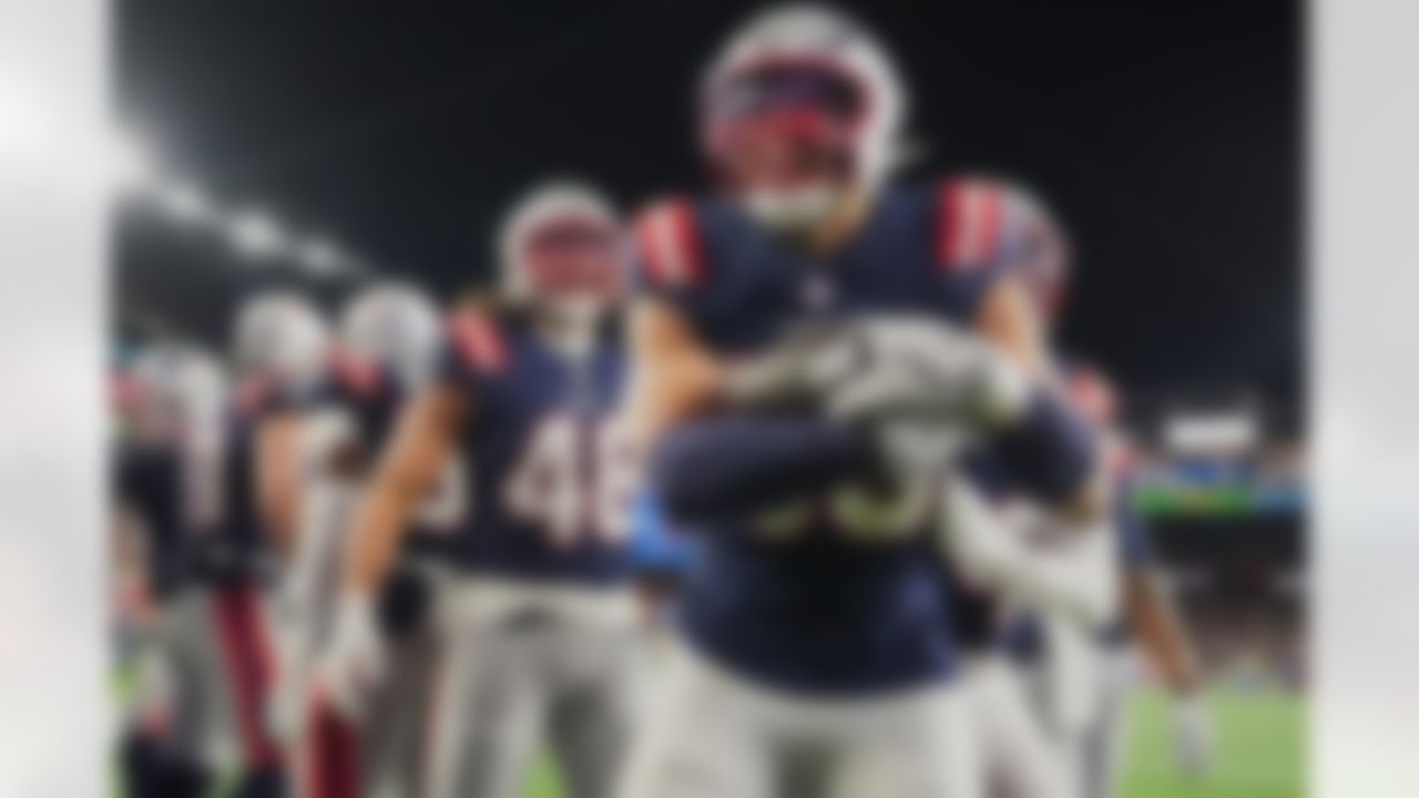 New England Patriots linebacker Christian Elliss celebrates after recovering a fumble by Los Angeles Chargers quarterback Justin Herbert in the second half of an NFL wild-card playoff football game in Foxborough, Mass., Sunday, Jan. 11, 2026.