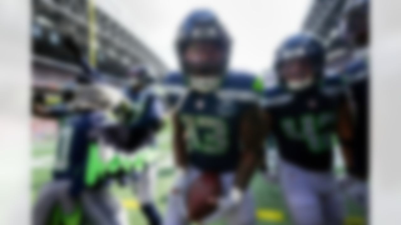 Seattle Seahawks linebacker Ernest Jones IV (13) celebrates after an interception during the second half of an NFL football game against the San Francisco 49ers, Sunday, Sept. 7, 2025, in Seattle.