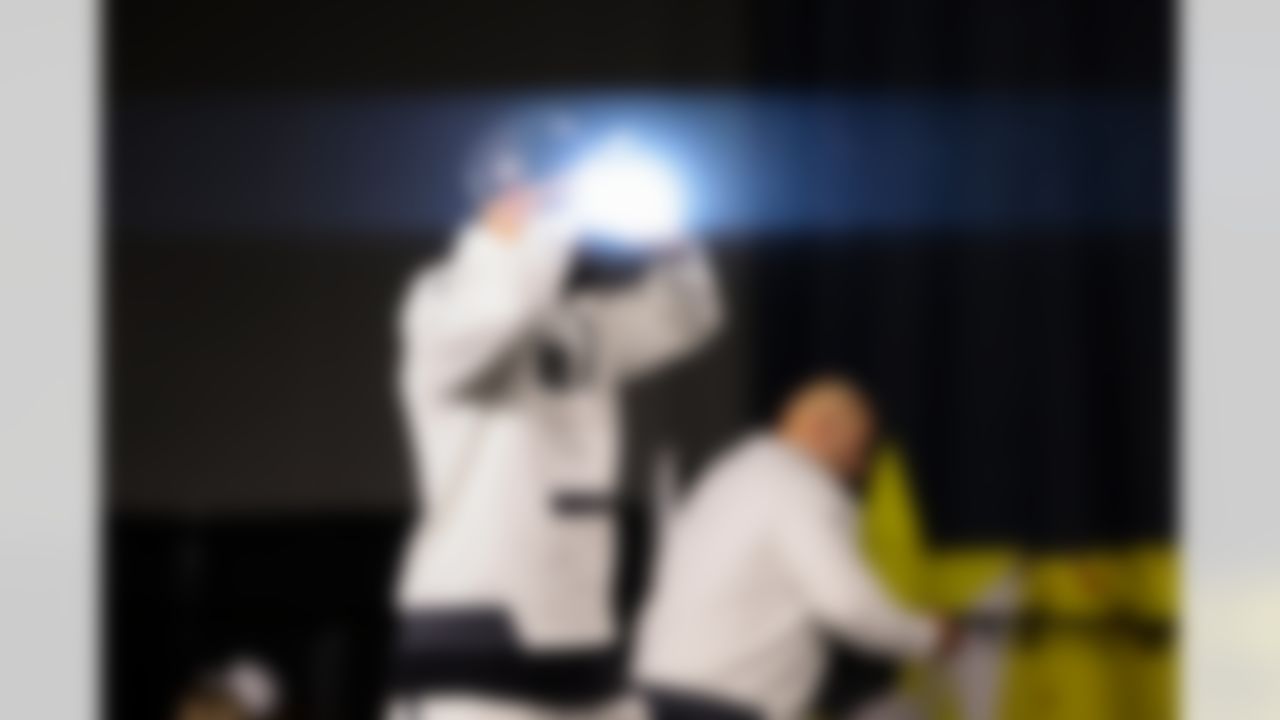 New England Patriots tight end CJ Dippre (82) takes a photo on stage during Opening Night ahead of Super Bowl LX on Monday, February 2, 2026 in San Jose, California.