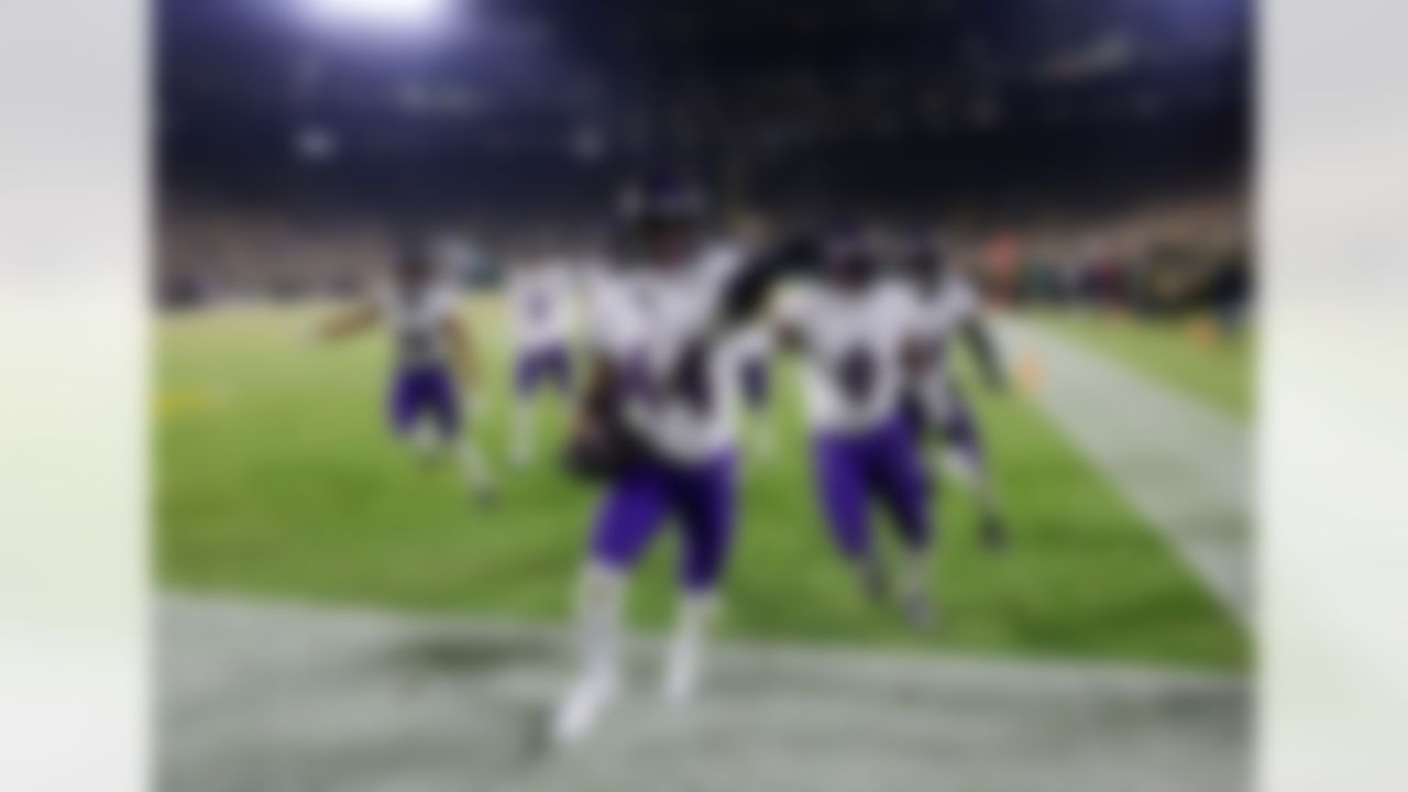Baltimore Ravens cornerback Marlon Humphrey (44) celebrates with teammates after intercepting a pass against the Green Bay Packers during the second half of an NFL football game, Saturday, Dec. 27, 2025, in Green Bay, Wis.