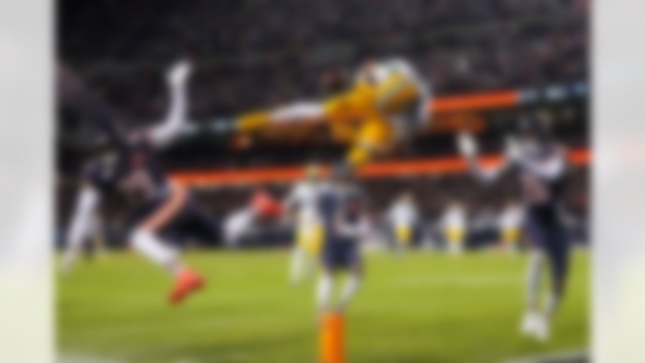 Green Bay Packers wide receiver Christian Watson (9) loses the ball after attempting to elude a tackle during an NFL football game against the Chicago Bears on Saturday, January 10, 2026 in Chicago, Illinois.