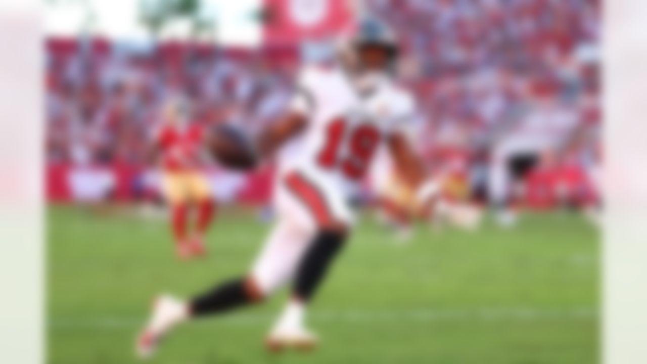 Tampa Bay Buccaneers wide receiver Kameron Johnson (19) scores a touchdown during an NFL football game against the San Francisco 49ers on Sunday, Oct. 12, 2025 in Tampa, Florida.