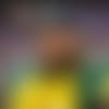 Green Bay Packers running back Josh Jacobs (8) looks on from the sideline during the national anthem prior to an NFL football game against the Dallas Cowboys, Sunday, Sept. 28, 2025, in Arlington, Texas. (Cooper Neill via AP)