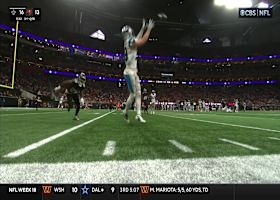 Adam Thielen knocks over the sideline camera after toe-tapping catch