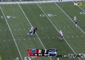 Geno Smith rips 18-yard pass over the middle to Smith-Njigba