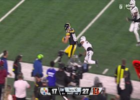 Freiermuth drags a Bengal downfield for an 18-yard gain