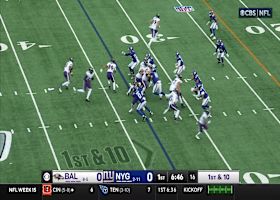 Lamar Jackson caps off a 14-yard run with a vicious stiff arm