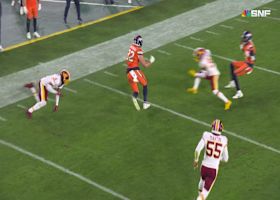 Adam Trautman makes a Commander miss for a 22-yard gain on fourth-and-one