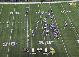 J.J. McCarthy delivers a dart under duress to Justin Jefferson for first down conversion