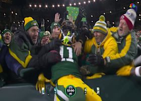 Love zips pass past defender to Reed for a Packers' TD