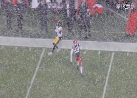 Wilson’s 35-yard loft cuts through the snow before landing in Jefferson’s mitts