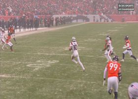 Drake Maye scurries through the snow flurries for a 13-yard gain