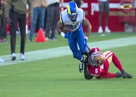 Blake Corum bursts through the 49ers defense for 15 yards before being tripped up by Mustapha